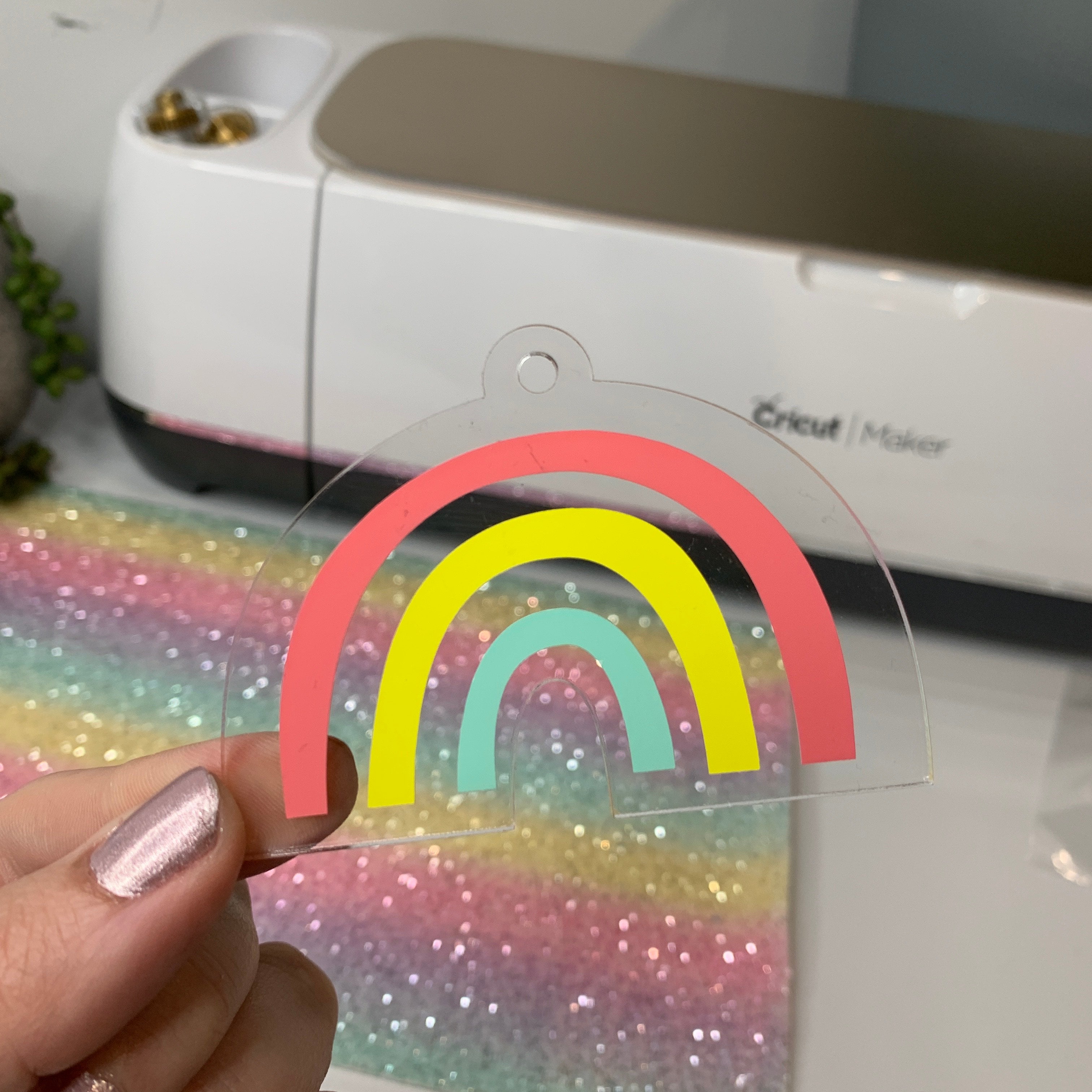Applying vinyl decal to Rainbow Acrylic Keyring using transfer tape