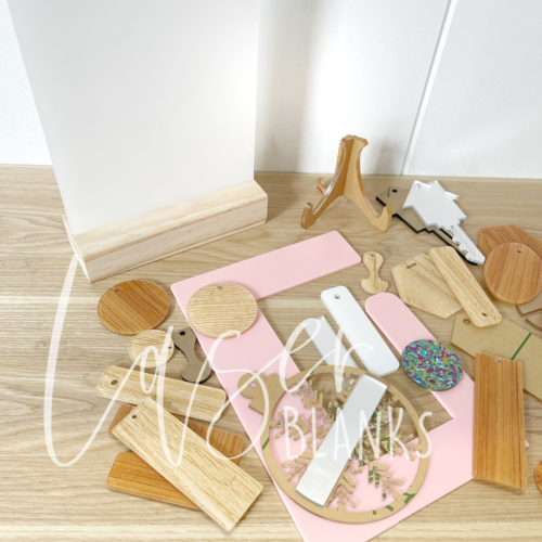 Laser Blanks sample box contents with assorted acrylic blanks and holiday baubles