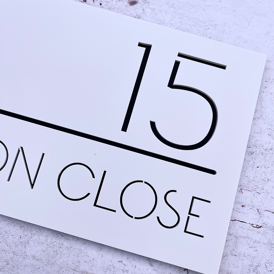 Weatherproof house number sign with contrasting layers