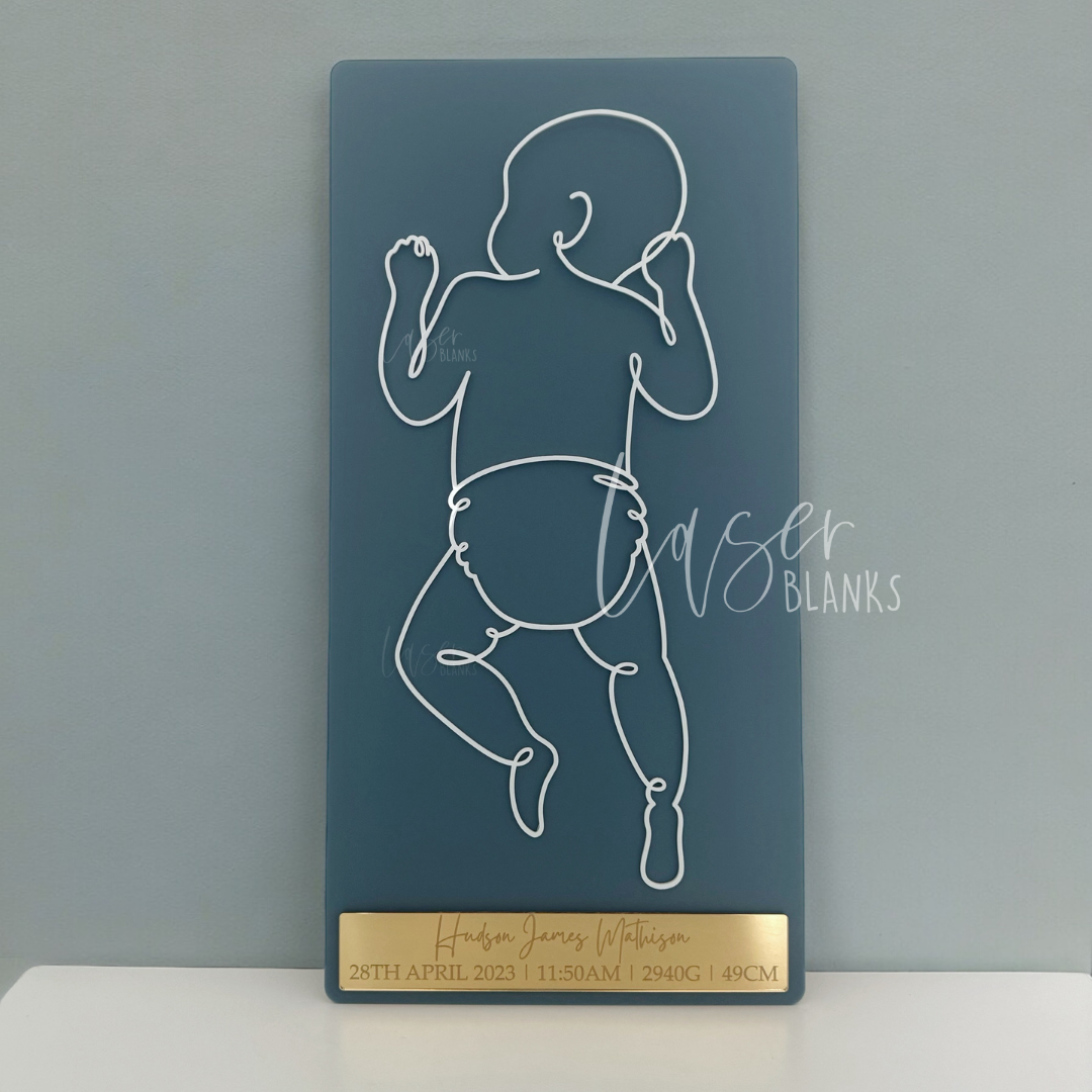 White acrylic baby silhouette cut to exact birth length on 600mm x 300mm board